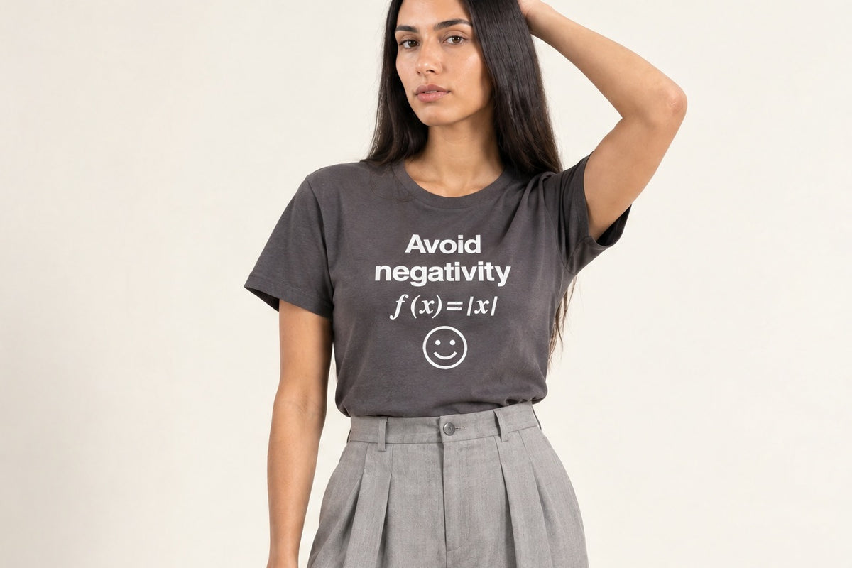 A woman in a grey Avoid Negativity math t-shirt