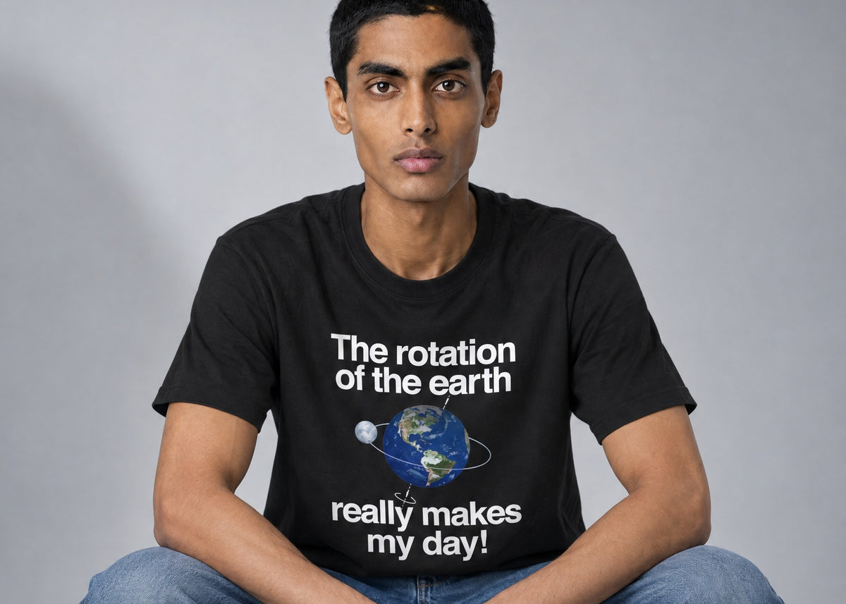 A man in a black The Rotation Of The Earth Really Makes My Day t-shirt