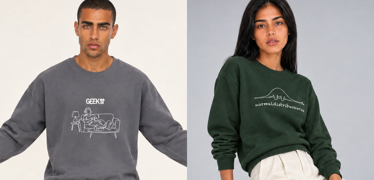 Two people wearing geek sweatshirts, a grey logo crewneck and a green line art design